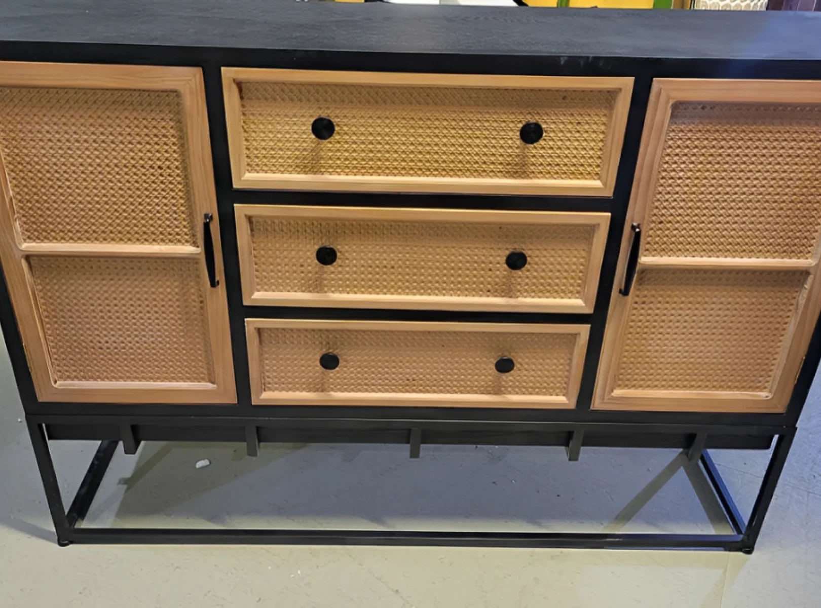 Wooden sideboard with drawers and cabinets.