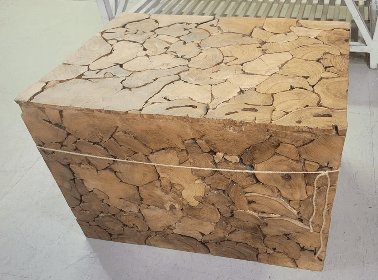 Wooden block sculpture with intricate patterns.