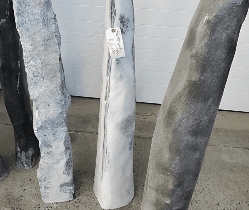 Stone pillars with price tag displayed outside.