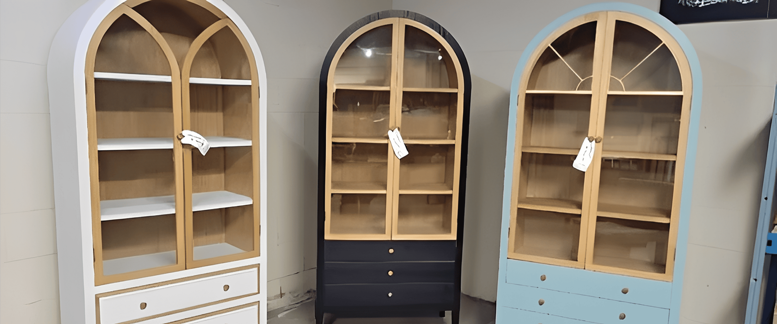 White, black, and blue arched display cabinets